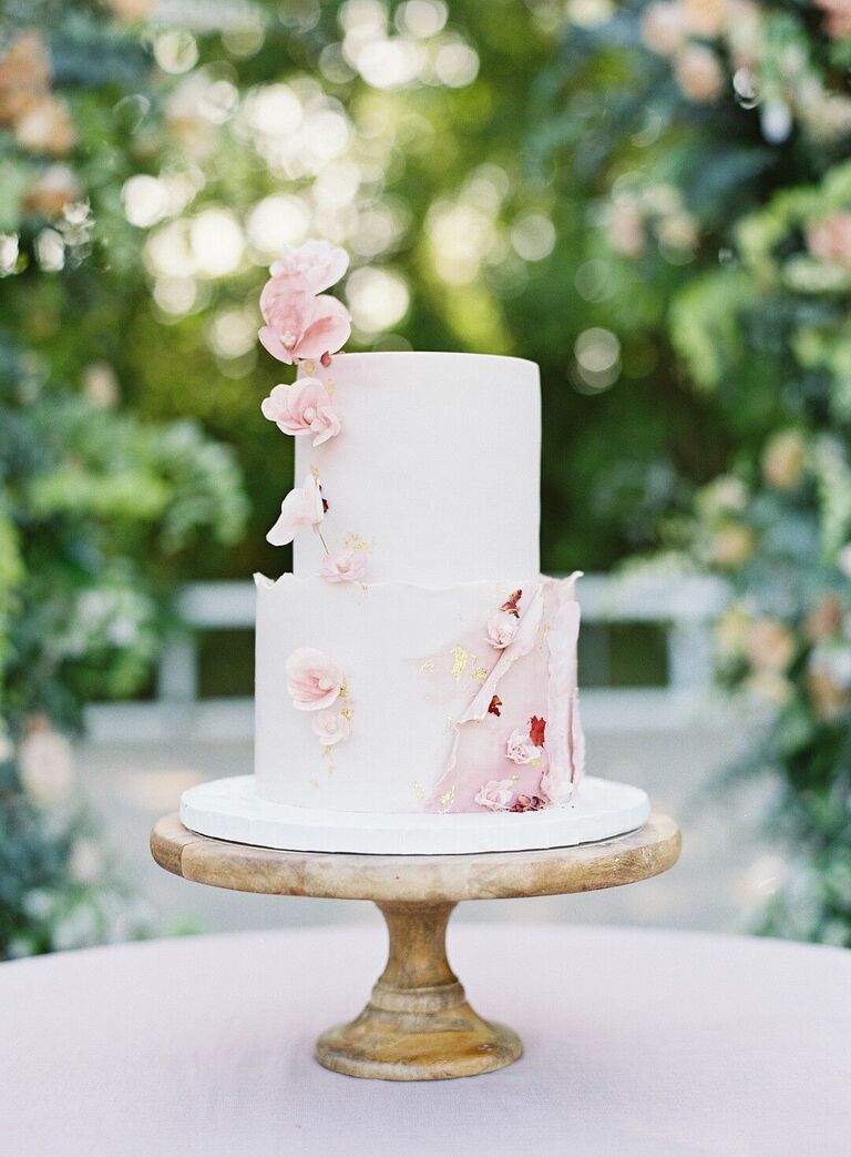 Romantic two-tier wedding cake with pink flowers