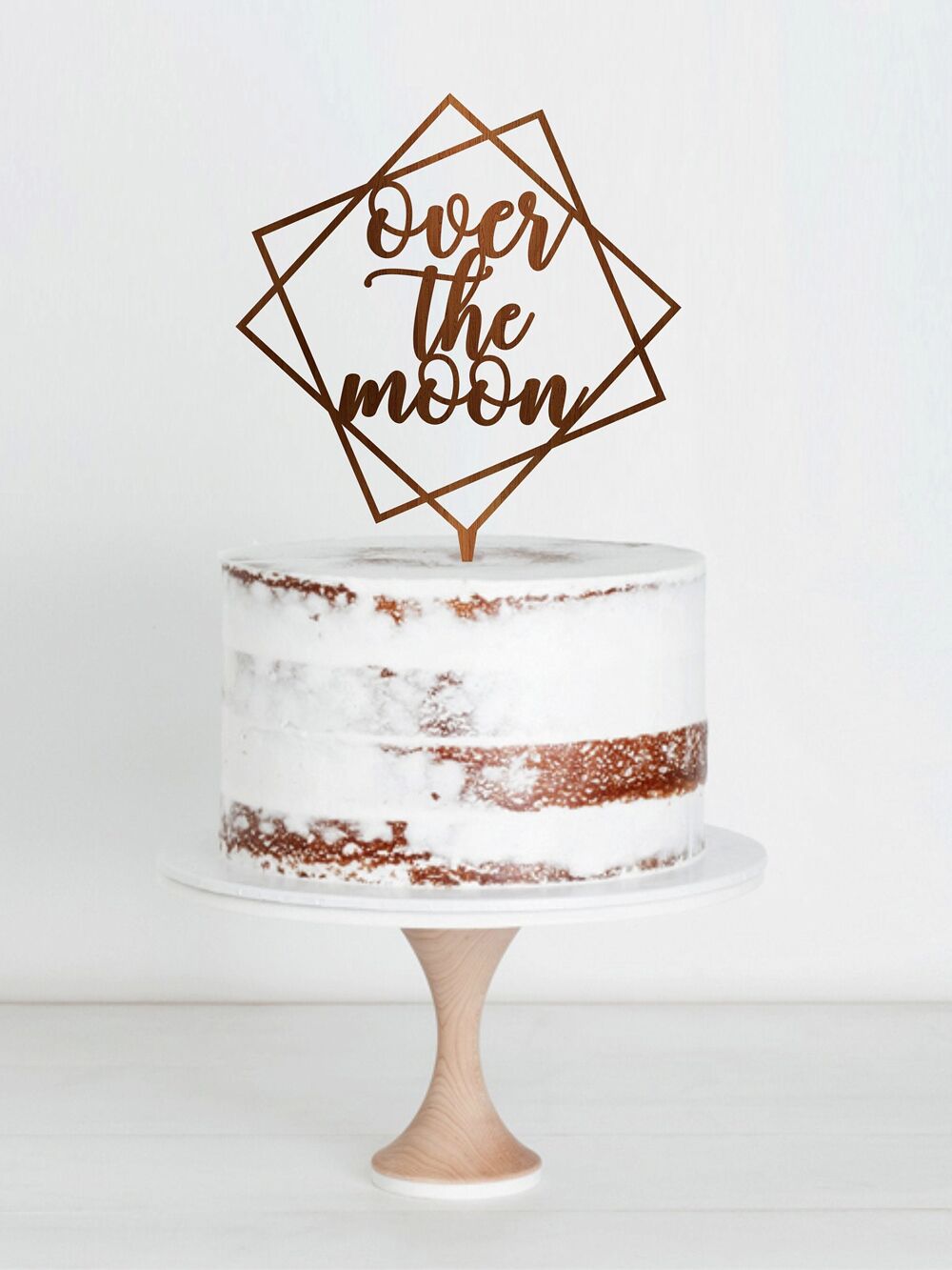 Over the Moon geometric wedding cake topper