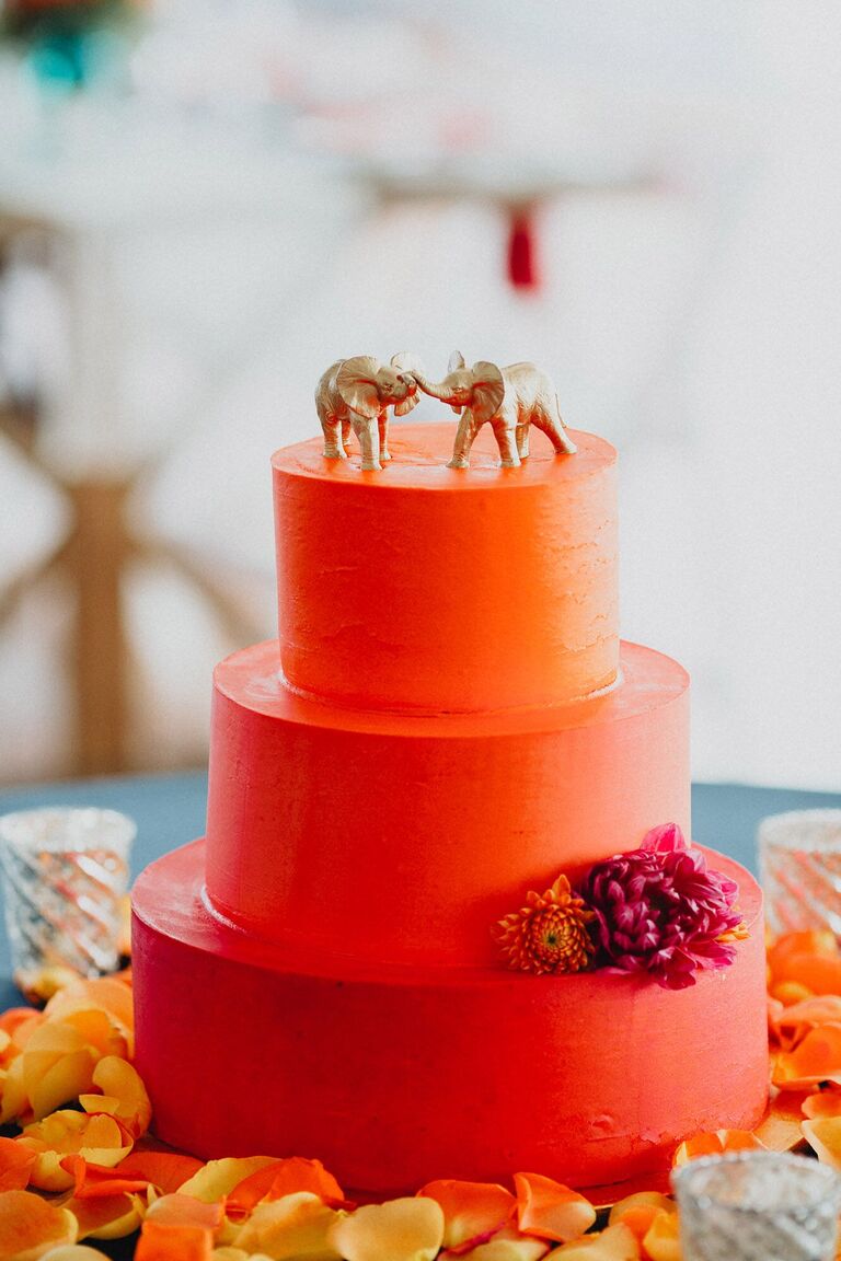 Three-tier bright orange wedding cake