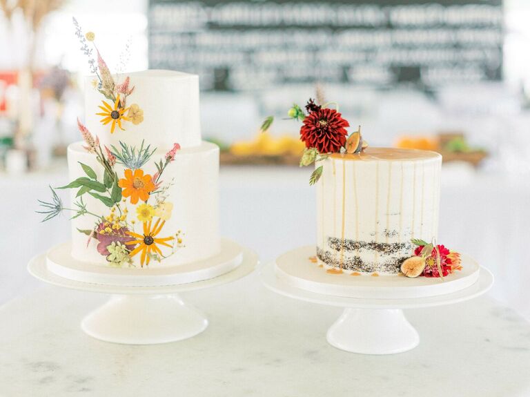 Two rustic wedding cakes with pressed flowers