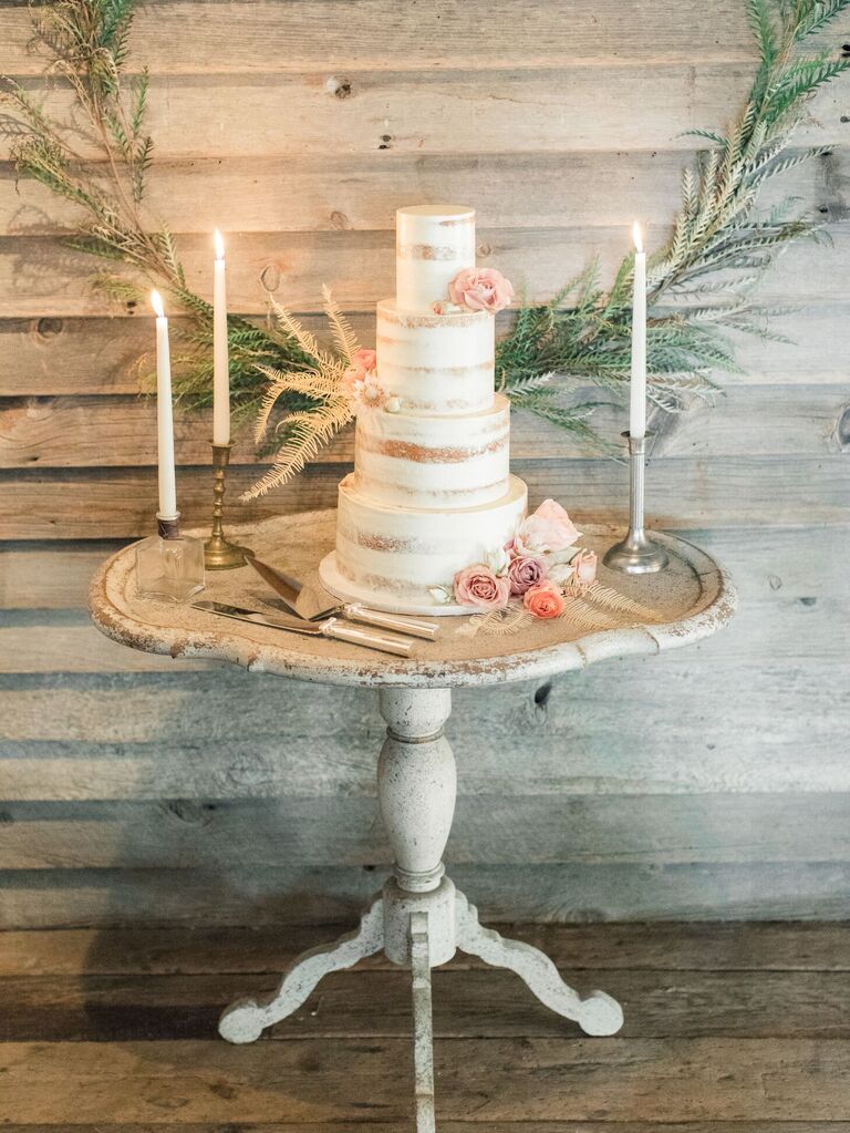 Semi-naked cake on rustic cake table