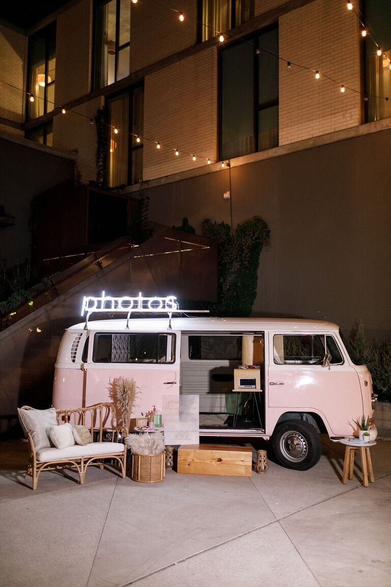 Pink VW bus photo booth with boho decorations