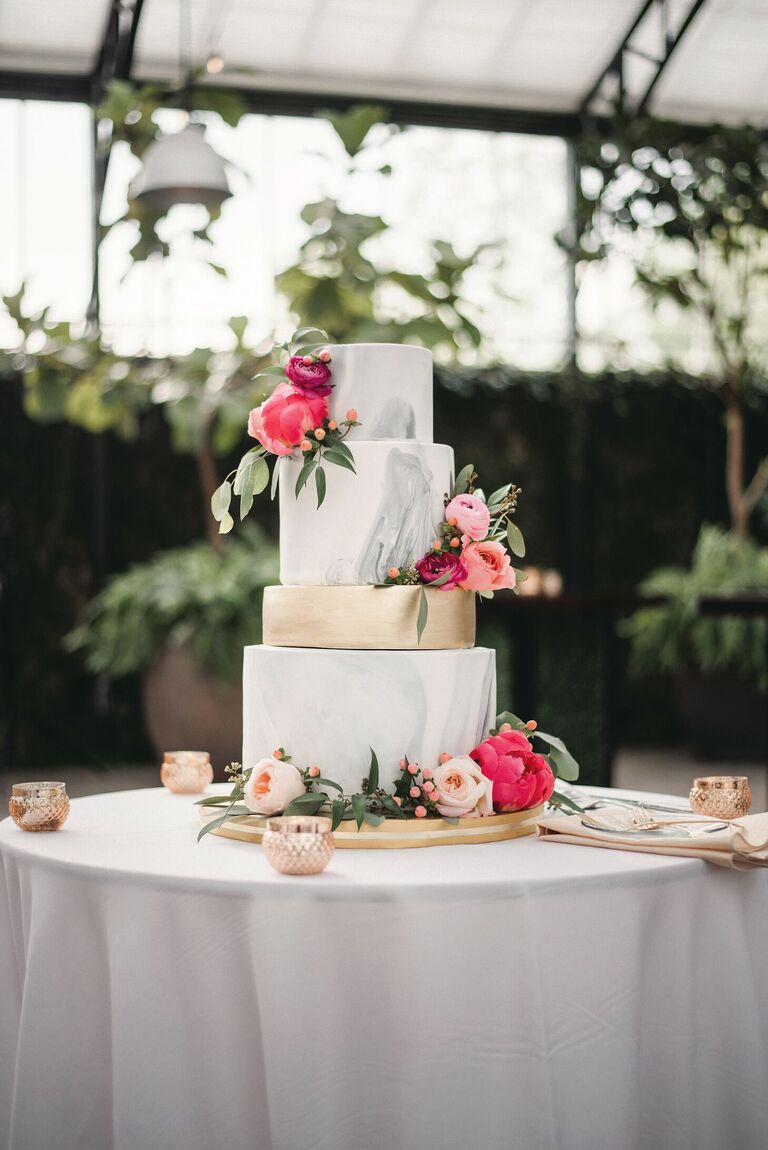 Four-tier gray marbled cake with pink peony decorations