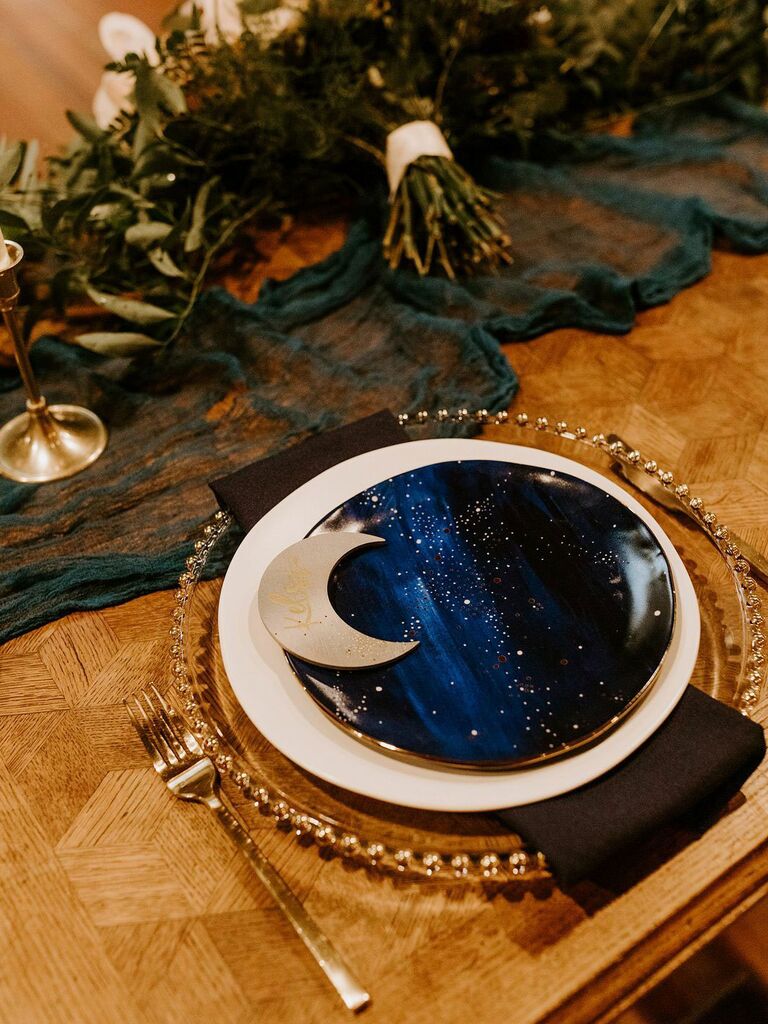 Astrology-inspired place setting with moon place card and navy and gold accents