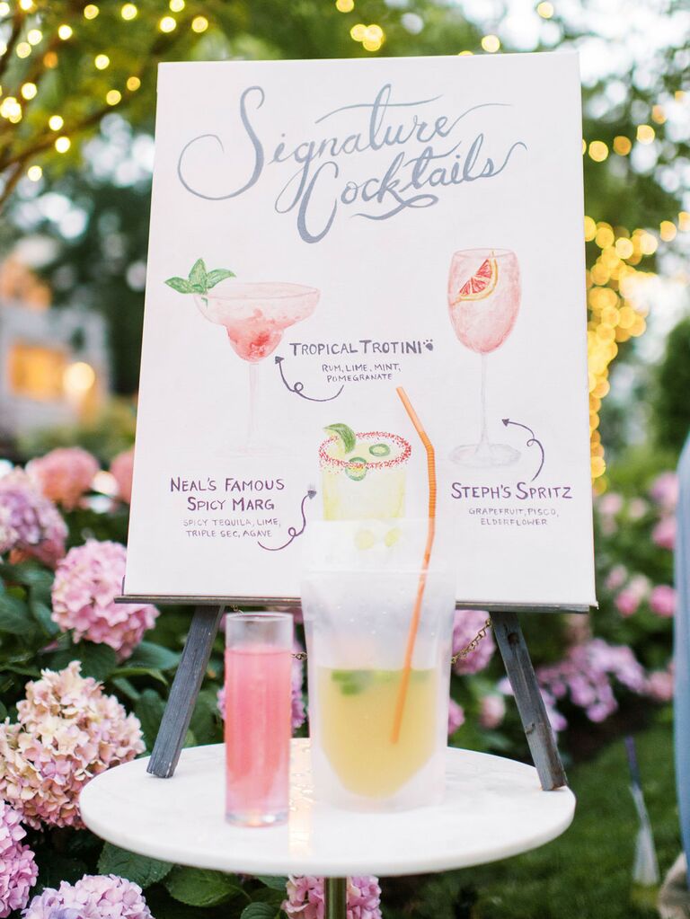 Custom cocktail art decoration at outdoor wedding reception